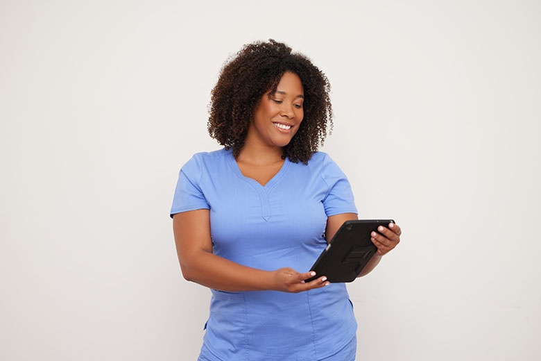 clinical employee looking at tablet